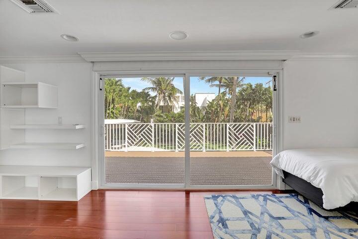 2100 Spanish River Road Boca Raton, FL 33432 - Photo 30 of 38 a bedroom with a bed and a window
