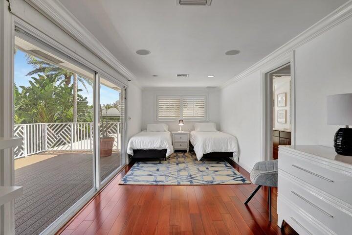 2100 Spanish River Road Boca Raton, FL 33432 - Photo 31 of 38 a bedroom with a large bed and a large window