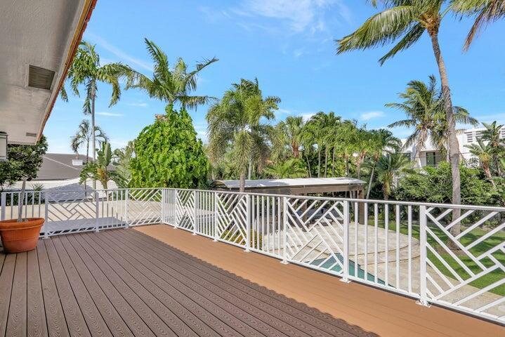 2100 Spanish River Road Boca Raton, FL 33432 - Photo 32 of 38 a balcony with wooden floor and fence