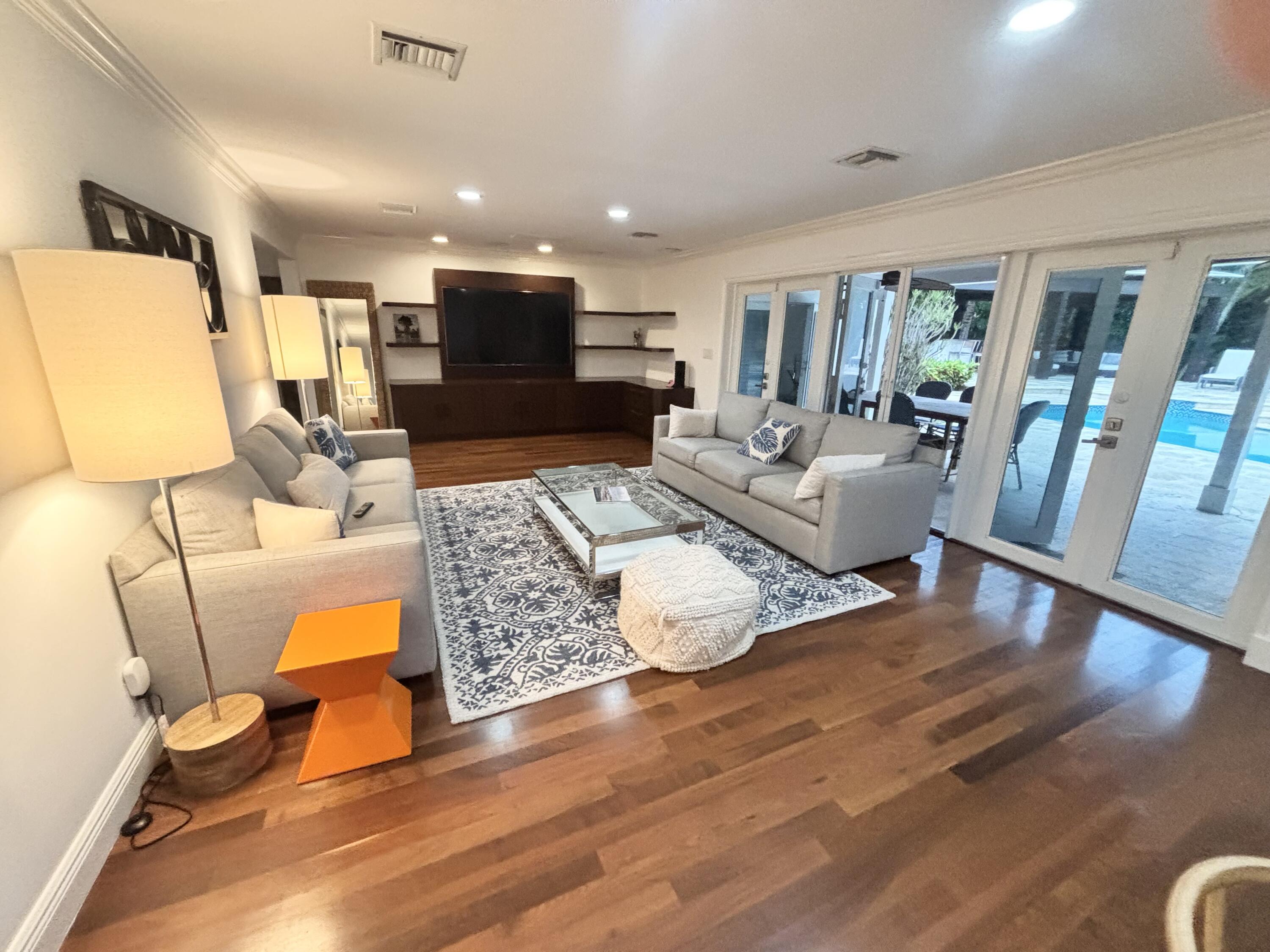 2100 Spanish River Road Boca Raton, FL 33432 - Photo 38 of 38 a living room with furniture and a wooden floor
