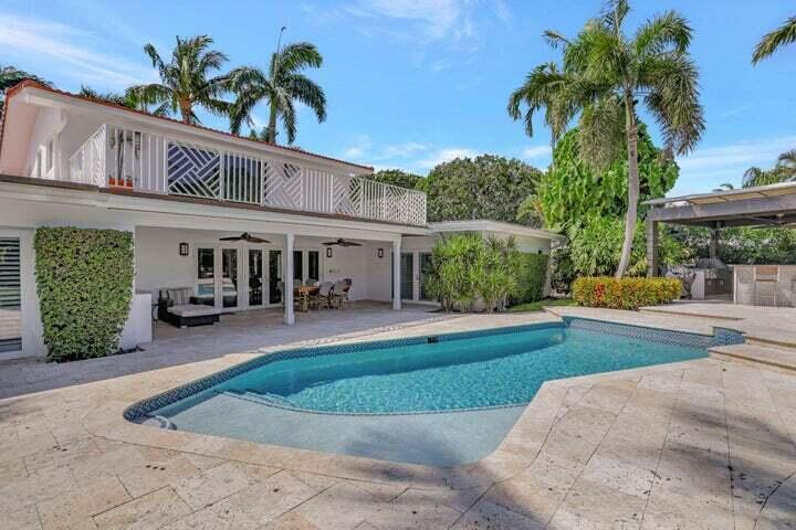 2100 Spanish River Road Boca Raton, FL 33432 - Photo 5 of 38 a front view of a house with garden