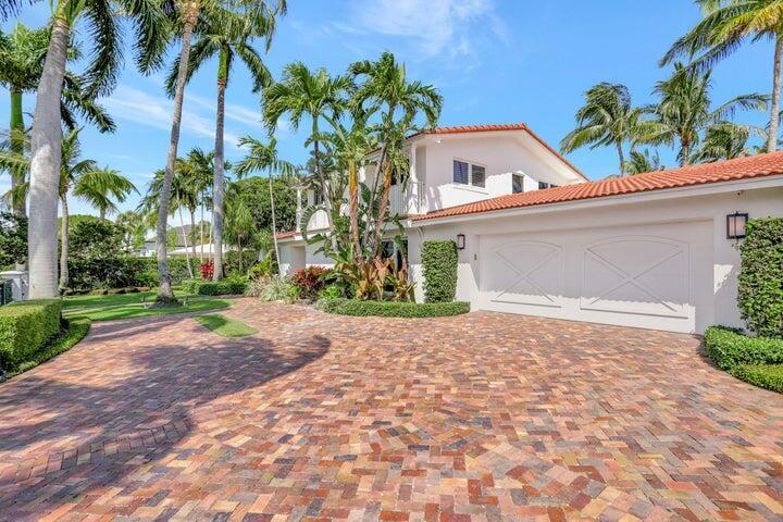 2100 Spanish River Road Boca Raton, FL 33432 - Photo 6 of 38 a front view of a house with a yard