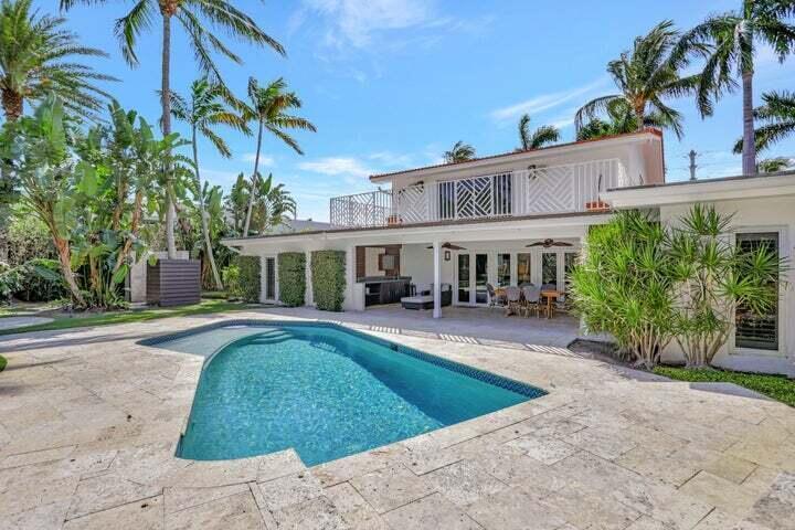 2100 Spanish River Road Boca Raton, FL 33432 - Photo 8 of 38 a view of a house with swimming pool and sitting area