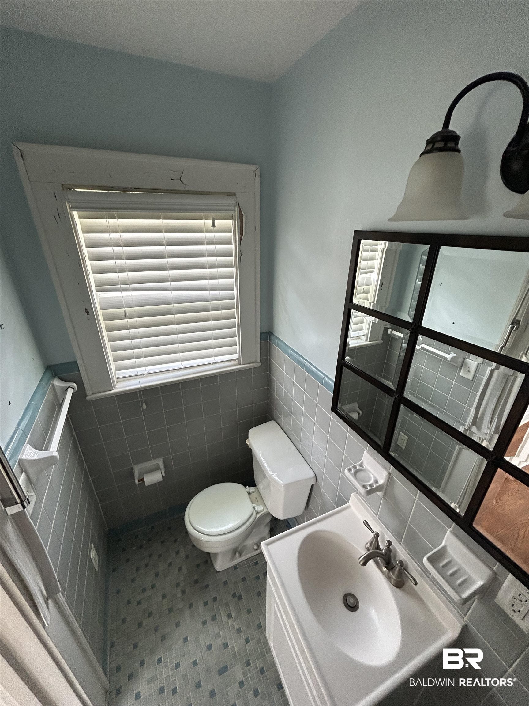 1405 Escambia Avenue Brewton, AL 36426 - Photo 15 of 16 Half bathroom featuring wainscoting, vanity, and tile walls