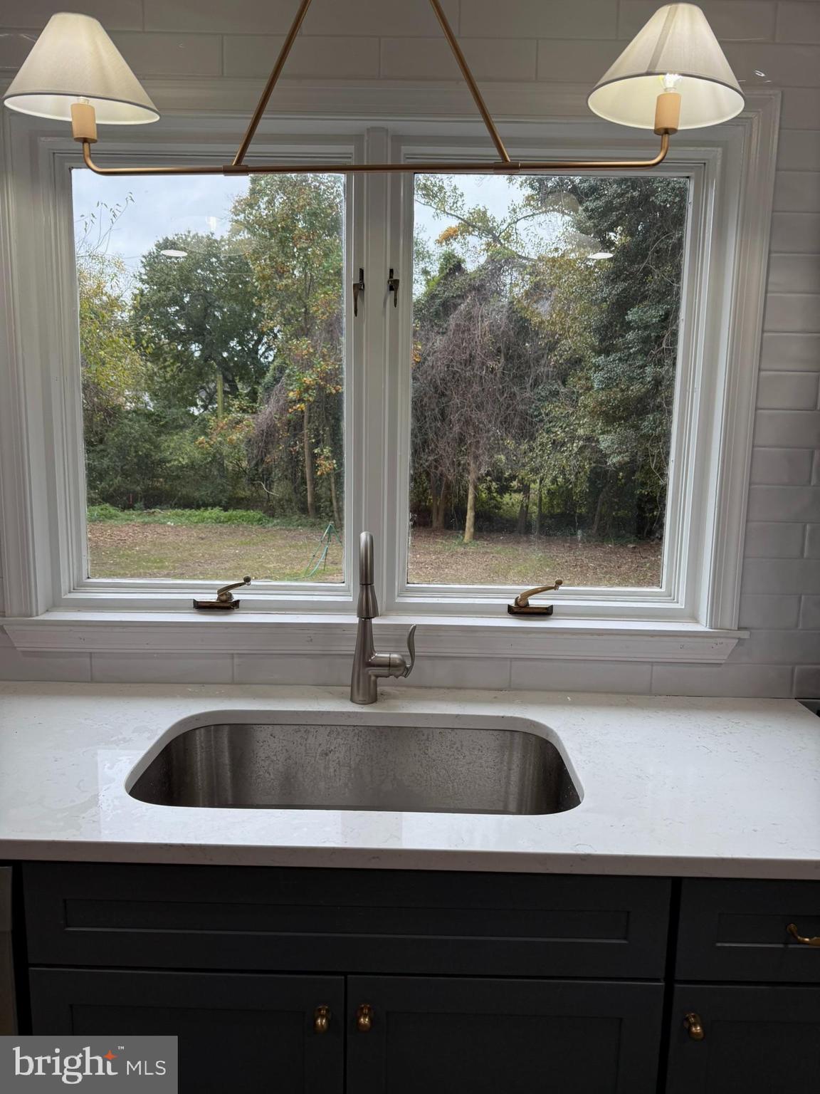 530 Woodsedge Road Dover, DE 19904 - Photo 17 of 52 a kitchen with a sink and a large window