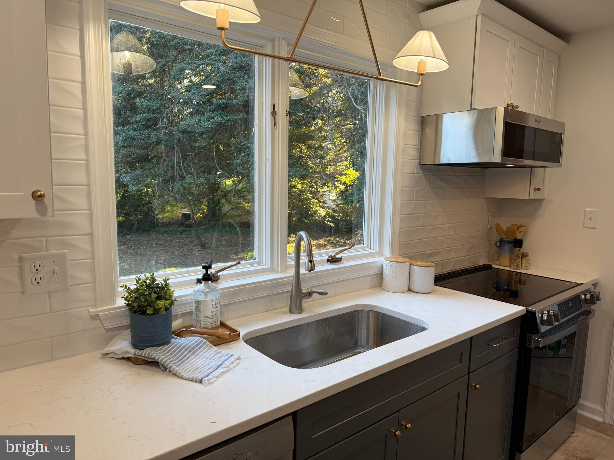 530 Woodsedge Road Dover, DE 19904 - Photo 18 of 52 a kitchen with a sink a counter top space and a wooden floor