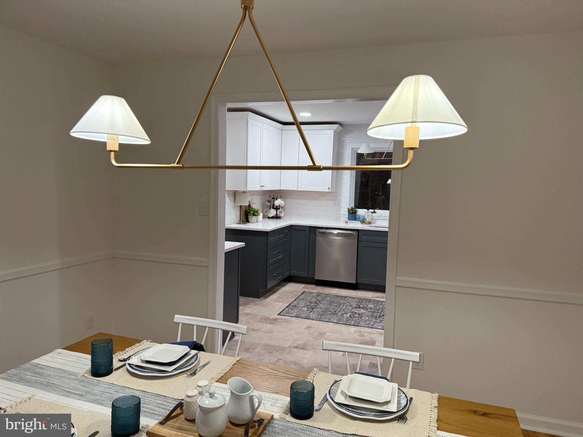 530 Woodsedge Road Dover, DE 19904 - Photo 21 of 52 a kitchen with a sink a stove and a table