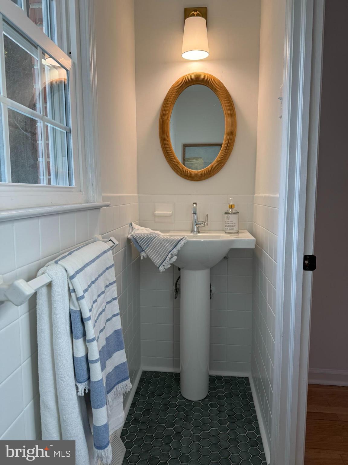 530 Woodsedge Road Dover, DE 19904 - Photo 28 of 52 a bathroom with a sink and a mirror