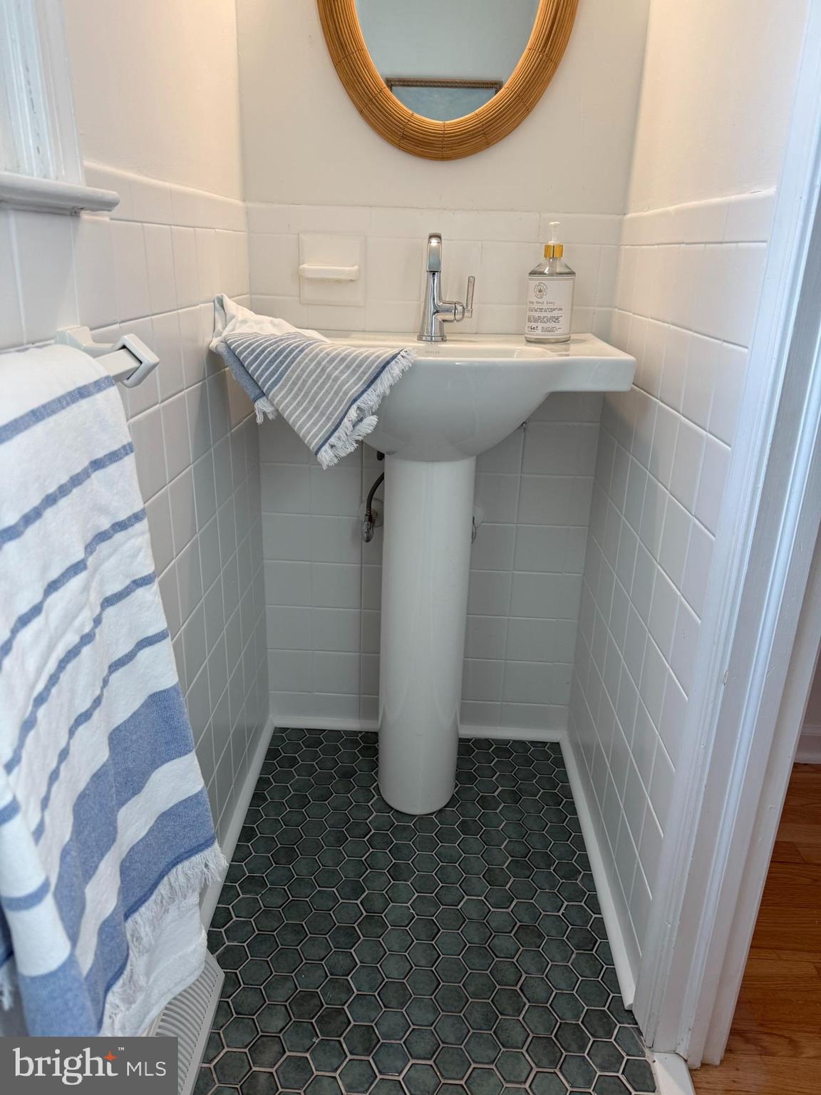 530 Woodsedge Road Dover, DE 19904 - Photo 29 of 52 a bathroom with a sink and mirror