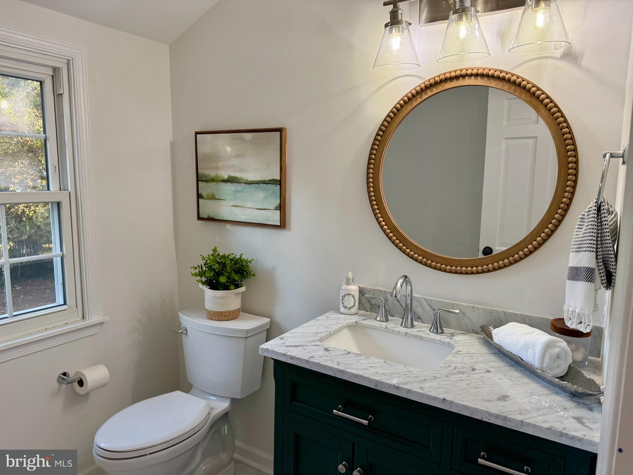 530 Woodsedge Road Dover, DE 19904 - Photo 43 of 52 a bathroom with a granite countertop toilet a sink and a mirror