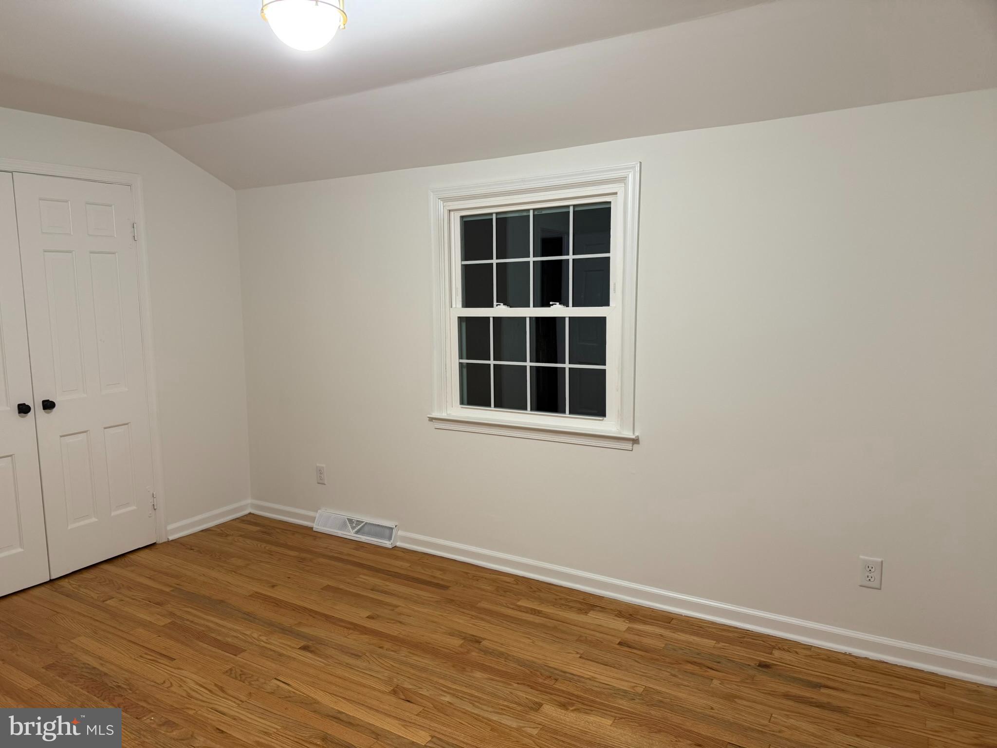 530 Woodsedge Road Dover, DE 19904 - Photo 45 of 52 a view of empty room with wooden floor and windows
