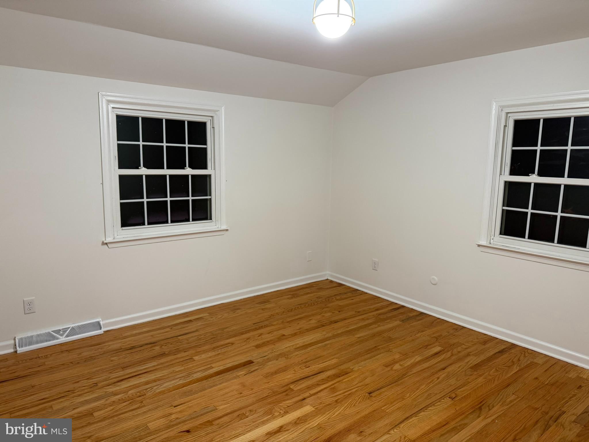 530 Woodsedge Road Dover, DE 19904 - Photo 46 of 52 a view of an empty room with wooden floor and windows