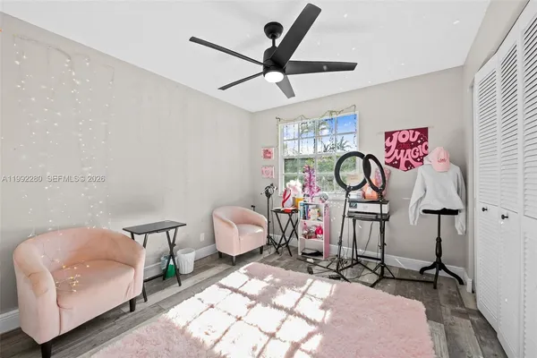 a spacious bedroom with a bed and a desk in it