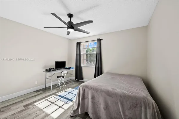 a bedroom with a bed and a dresser