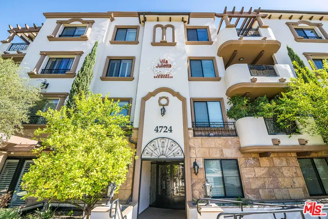 a front view of a building with garden