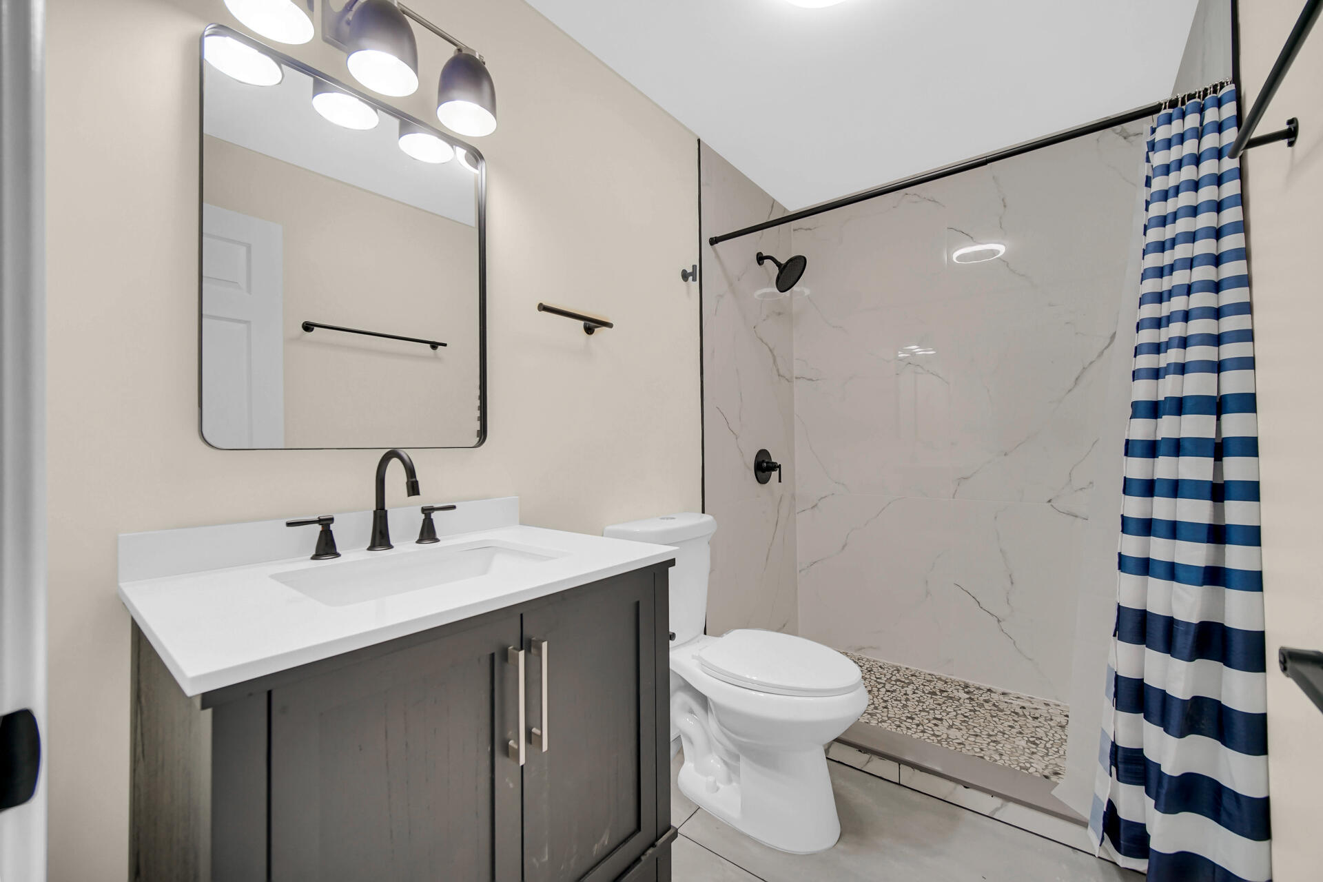 2232 Roosevelt Place Gary, IN 46404 - Photo 11 of 21 a bathroom with a sink a toilet a mirror and shower