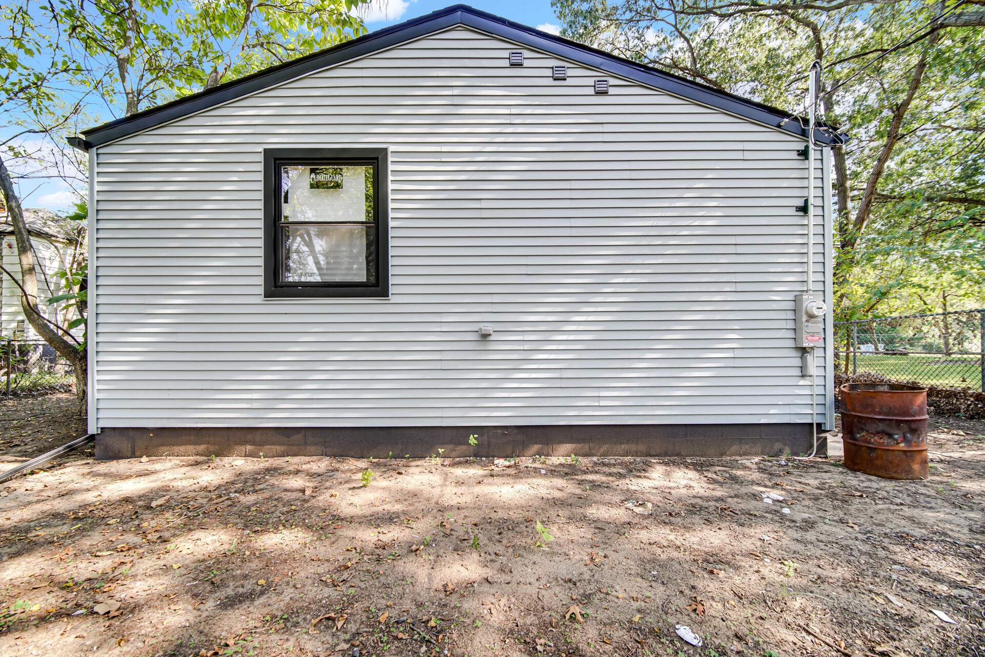 2232 Roosevelt Place Gary, IN 46404 - Photo 17 of 21 a side view of a house with a yard