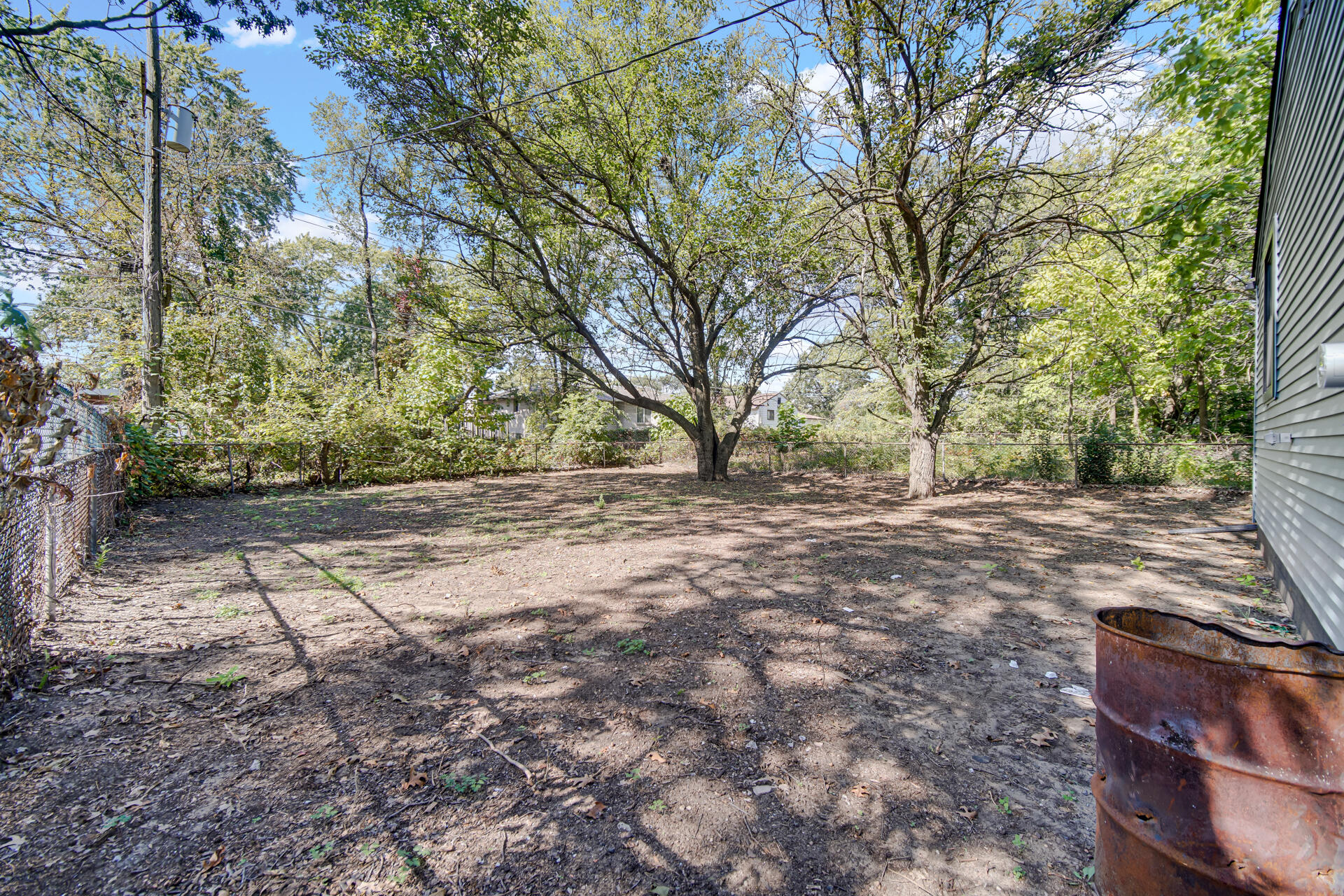 2232 Roosevelt Place Gary, IN 46404 - Photo 18 of 21 a view of dirt yard with a tree