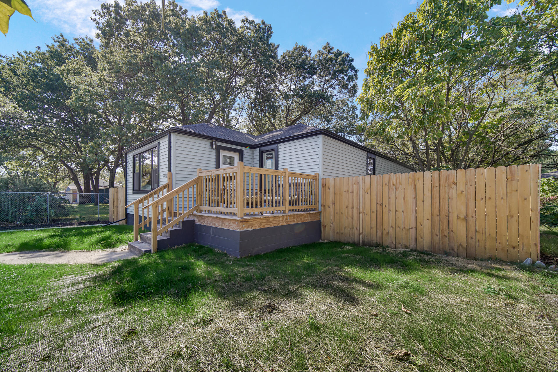 2232 Roosevelt Place Gary, IN 46404 - Photo 20 of 21 a view of a house with a yard plants and large trees
