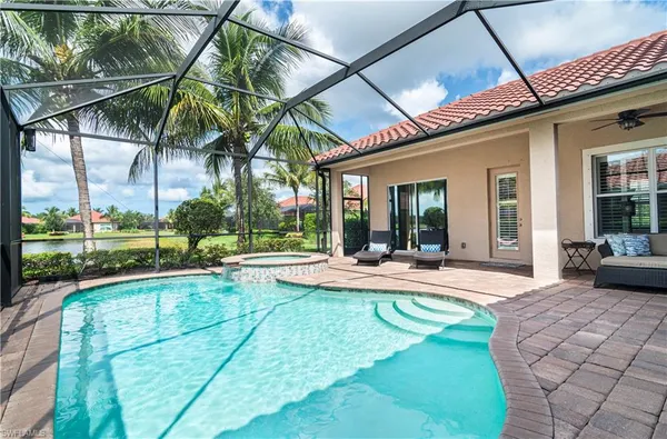a view of a house with sitting area and a yard