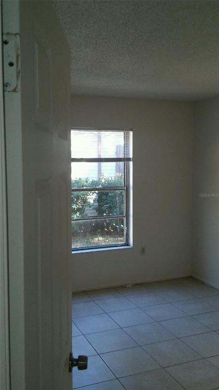 3648 Meriden Avenue Oldsmar, FL 34677 - Photo 4 of 5 an empty room with a window