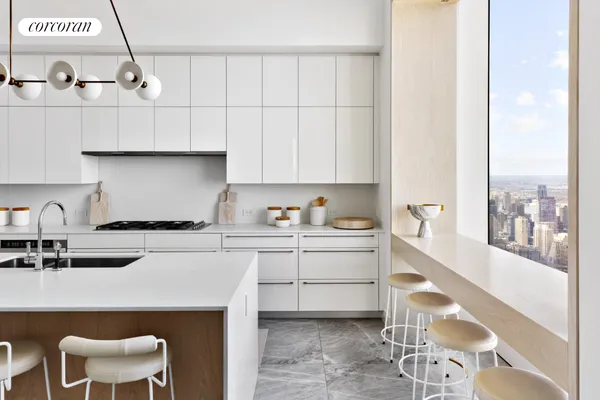 a kitchen with a sink a stove and a refrigerator
