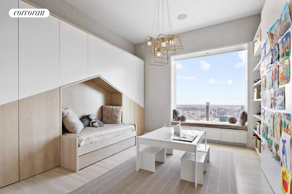 a room with kitchen island a table and chairs in it