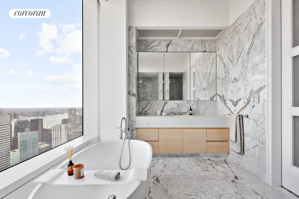 a bathroom with a bathtub and shower