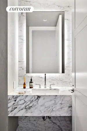 a bathroom with a sink and a large mirror