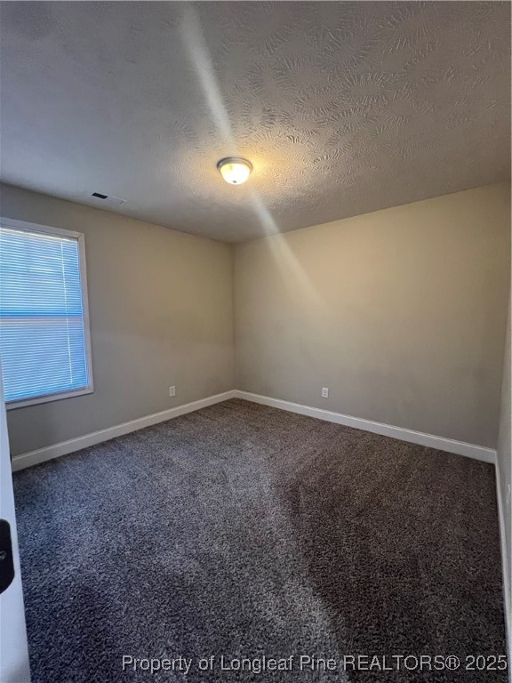 1628 Strickland Bridge Road Fayetteville, NC 28304 - Photo 15 of 20 an empty room with a projector