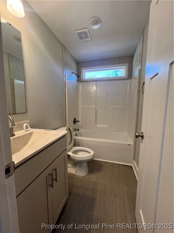1628 Strickland Bridge Road Fayetteville, NC 28304 - Photo 16 of 20 a bathroom with a granite countertop sink toilet a shower and a mirror