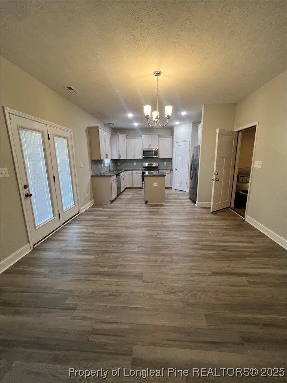 1628 Strickland Bridge Road Fayetteville, NC 28304 - Photo 7 of 20 a view of a living room and kitchen with furniture