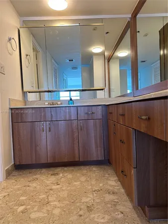 a white toilet sitting next to a sink