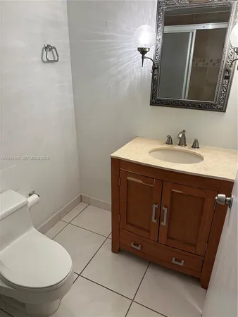 a bathroom with a sink and toilet