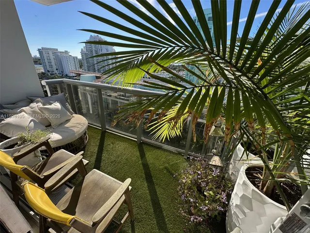 a large kitchen with a sink and cabinets