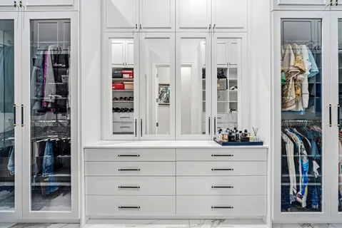 a view of a swimming pool with lawn chairs under an umbrella