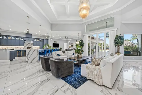 a large kitchen with stainless steel appliances granite countertop a stove and cabinets