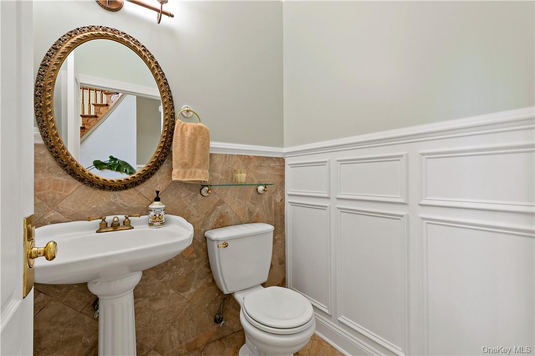 4 Sonoma Road Cortlandt Manor, NY 10567 - Photo 14 of 31 a bathroom with a sink mirror toilet and a window