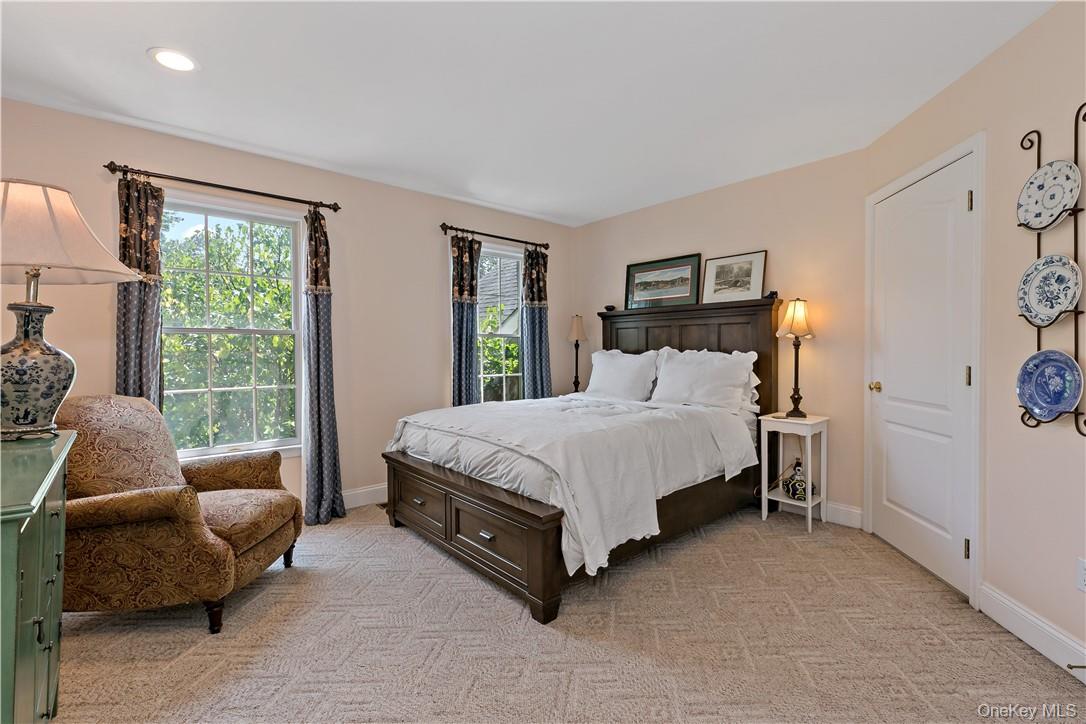 4 Sonoma Road Cortlandt Manor, NY 10567 - Photo 22 of 31 a bedroom with a bed and a couch