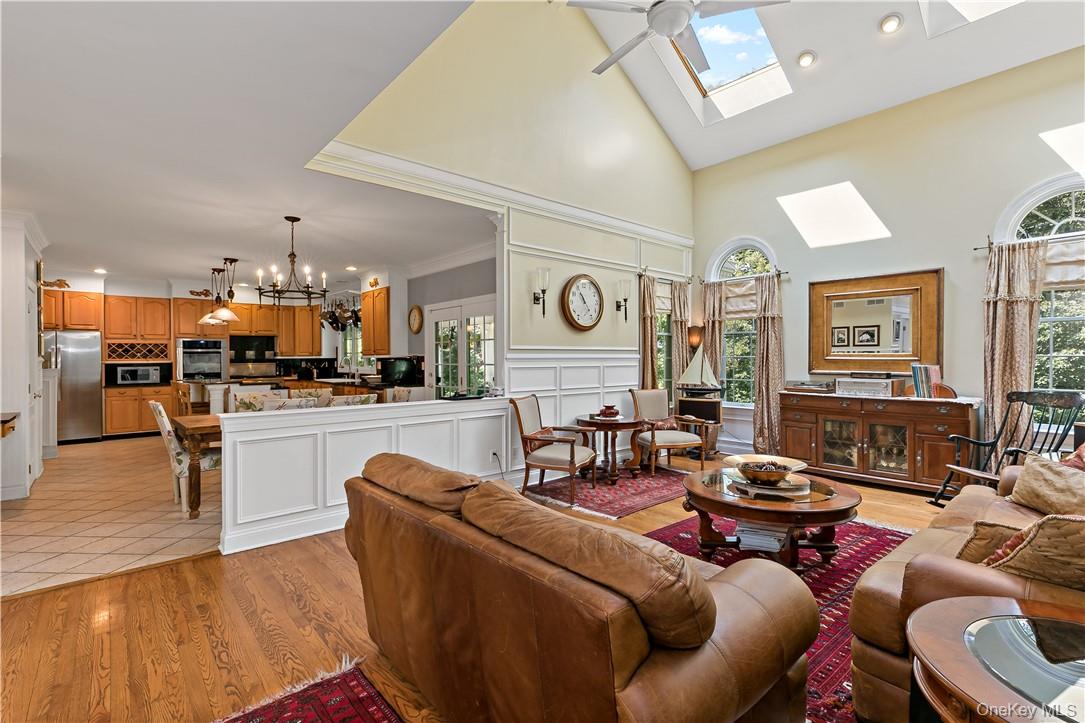 4 Sonoma Road Cortlandt Manor, NY 10567 - Photo 6 of 31 a living room with furniture kitchen view and a large window