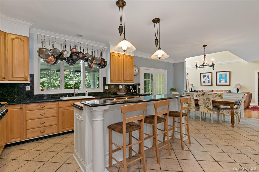 4 Sonoma Road Cortlandt Manor, NY 10567 - Photo 10 of 31 a large kitchen with a table and chairs in it