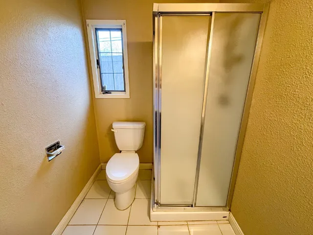a bathroom with a toilet and a sink