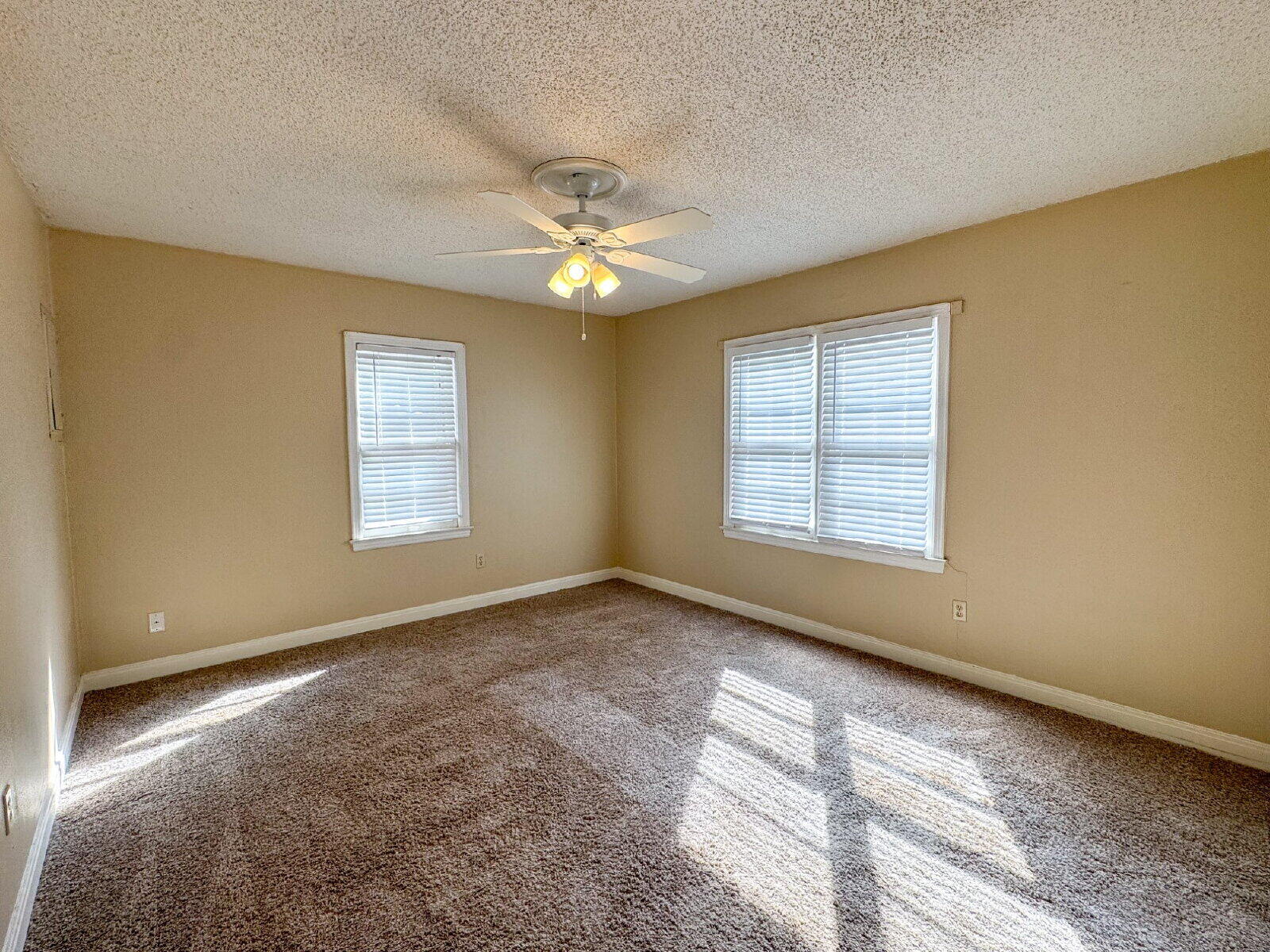 2909 Canton Avenue Lubbock, TX 79410 - Photo 13 of 18 a view of an empty room with a window