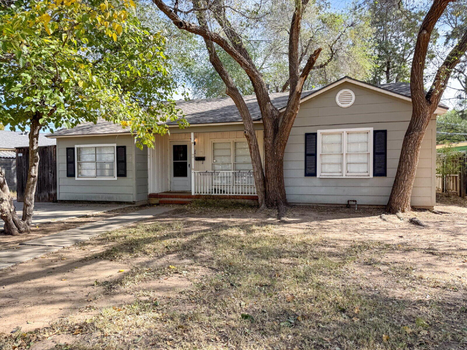 2909 Canton Avenue Lubbock, TX 79410 - Photo 2 of 18 a front view of a house with a yard and garage