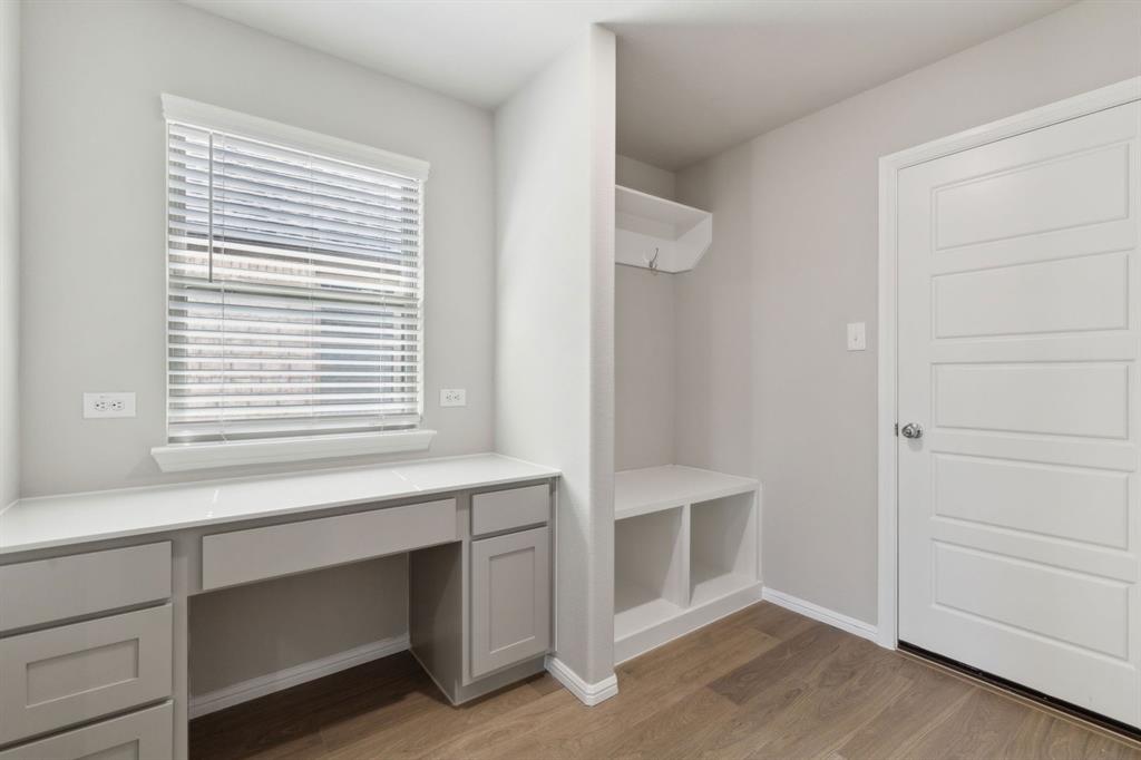 475 Sierra Ridge Lavon, TX 75166 - Photo 27 of 36 a view of an empty room with wooden floor and a window