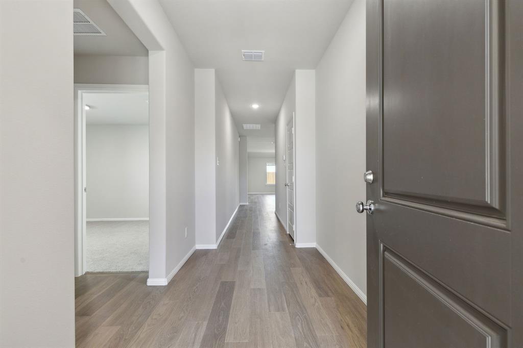 475 Sierra Ridge Lavon, TX 75166 - Photo 29 of 36 a view of a hallway with wooden floor