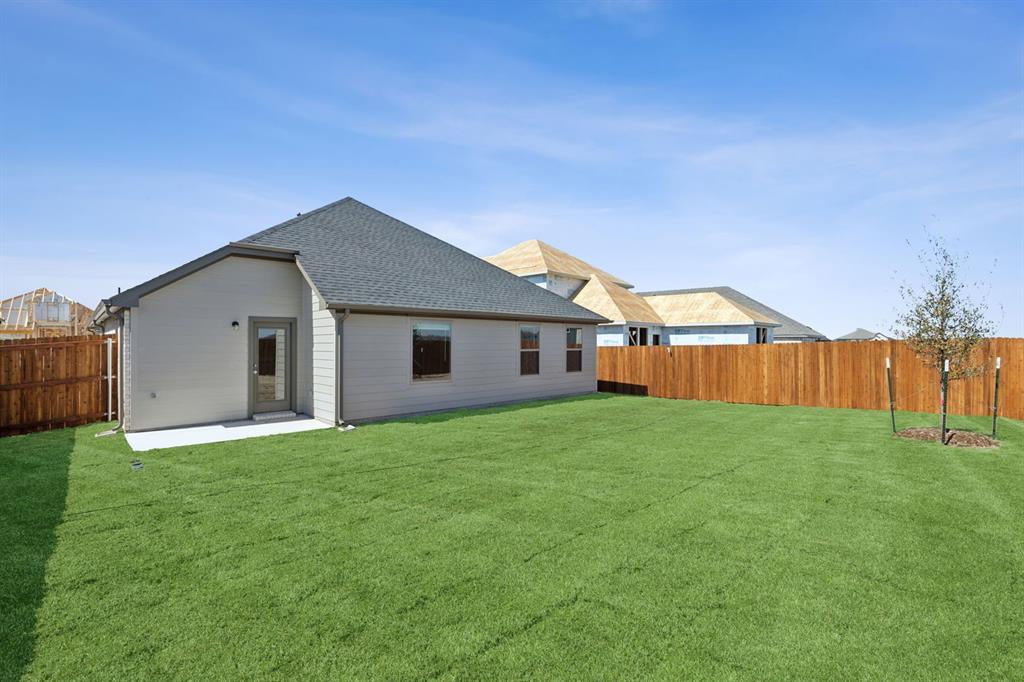 475 Sierra Ridge Lavon, TX 75166 - Photo 30 of 36 a backyard of a house with wooden fence
