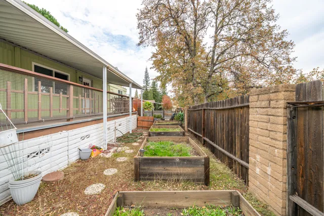 a view of house with backyard