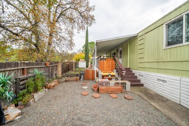 a view of a chair and tables in the patio