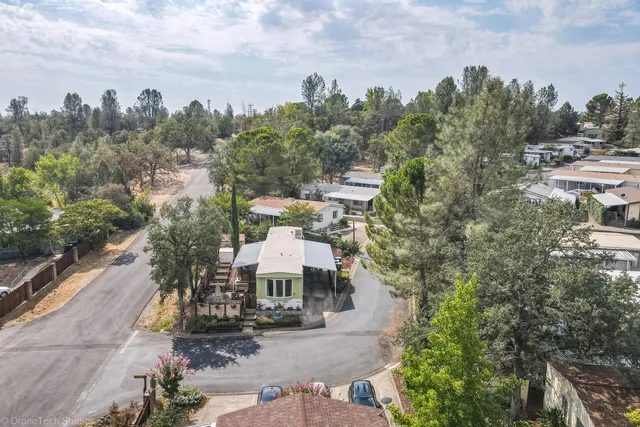 an aerial view of a house with outdoor space
